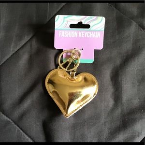 Puffy gold colored key ring/ purse charm.    NWT